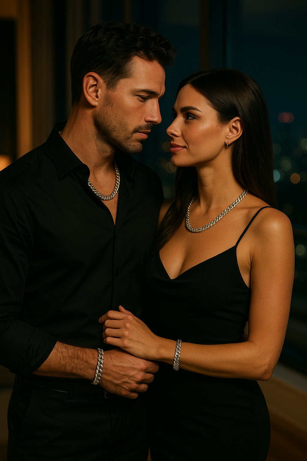 Man and woman in formal attire standing close together with a blurred background