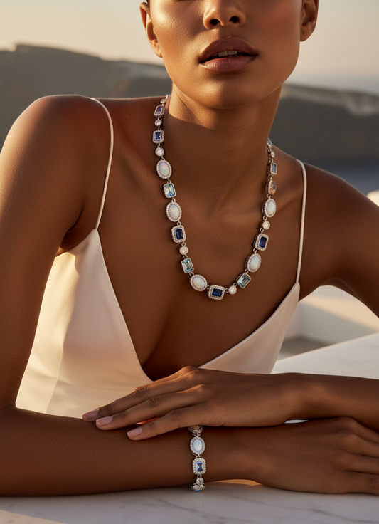 Woman wearing a necklace and bracelet with a scenic background