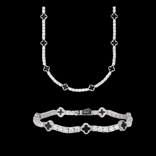 A matching set of black onyx clover necklace and bracelet with hand-set 5A cubic zirconia stones, rhodium-plated over a premium metal base.