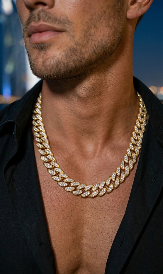 Man wearing a gold box chain necklace with an open collar shirt by The Flaire