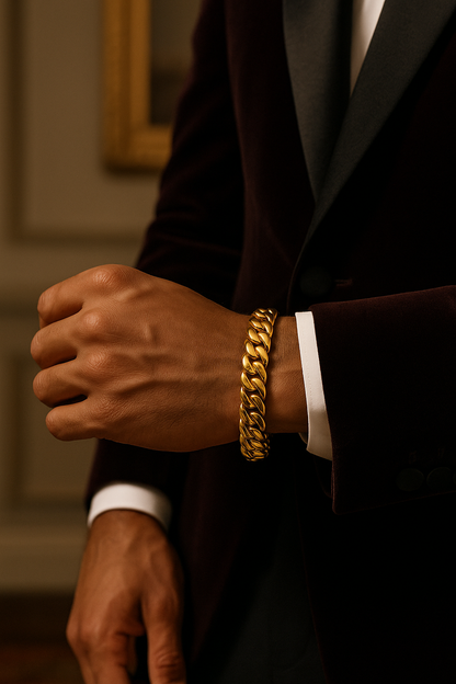 Person wearing a gold bracelet on a blurred background
