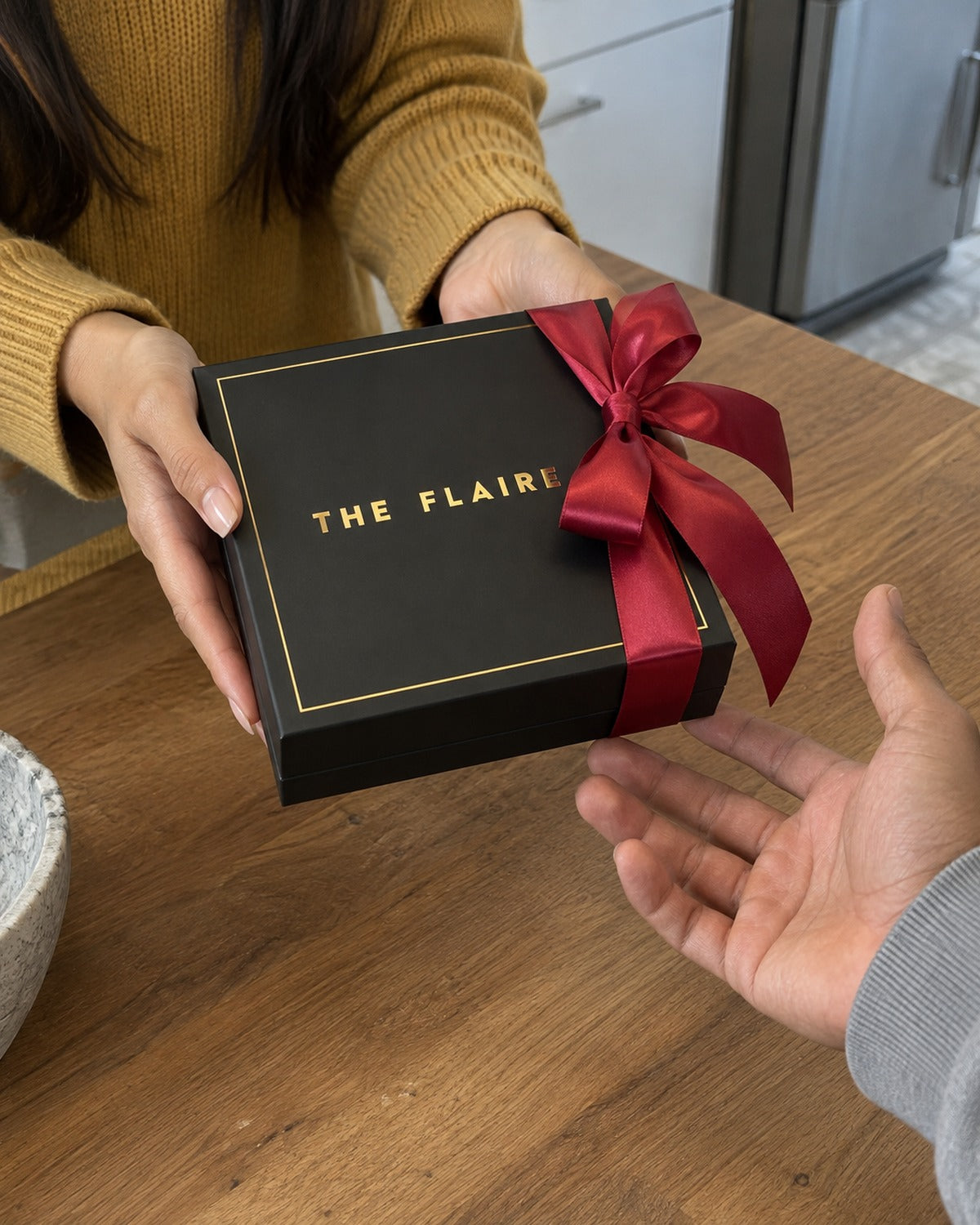 Ember Gift Box Gold: she hands it over