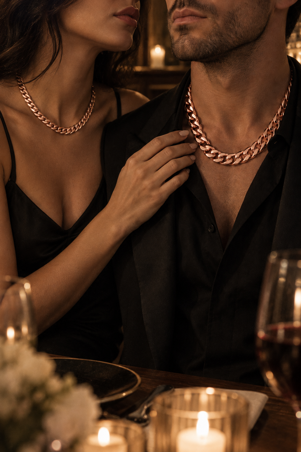 Luxor Chain Rose Gold worn by a couple at a candlelit dinner