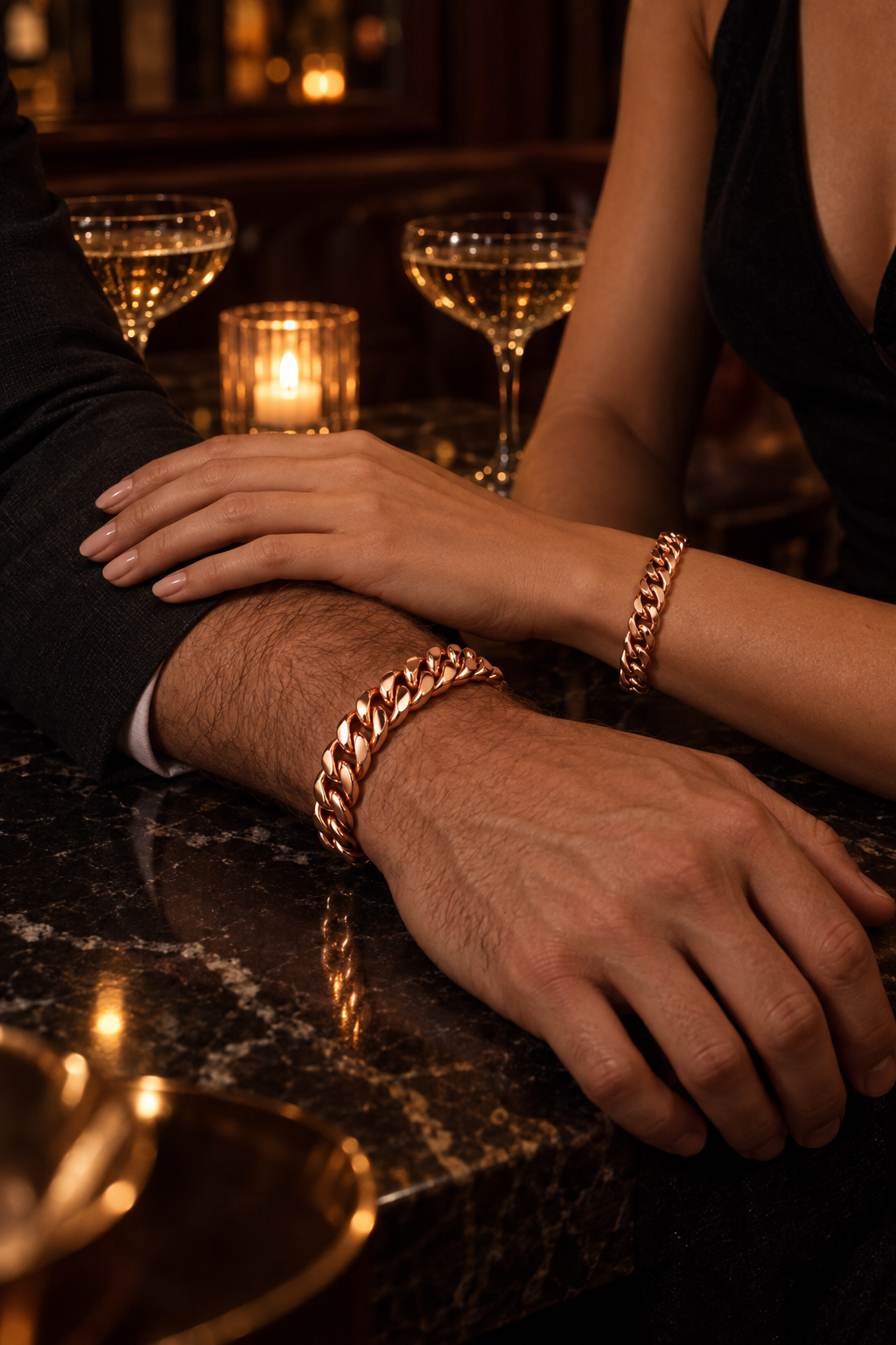 Luxor Bracelet Rose Gold worn by a couple, her hand resting on his forearm