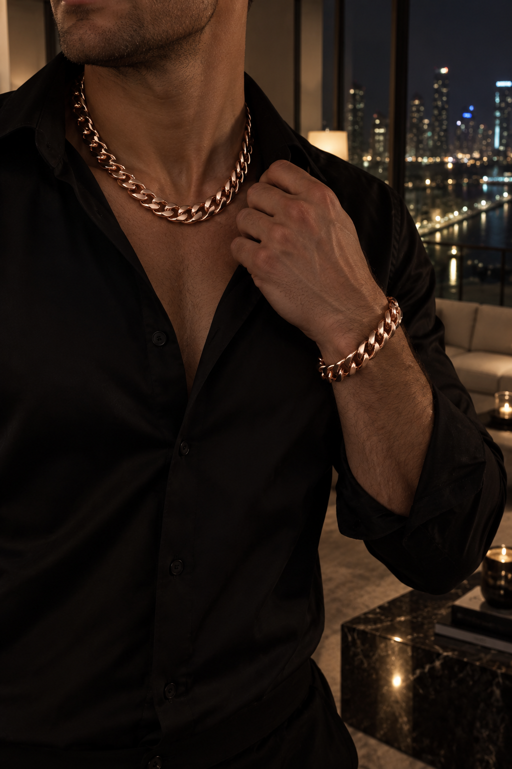Luxor Set Rose Gold chain and bracelet worn in a penthouse at night